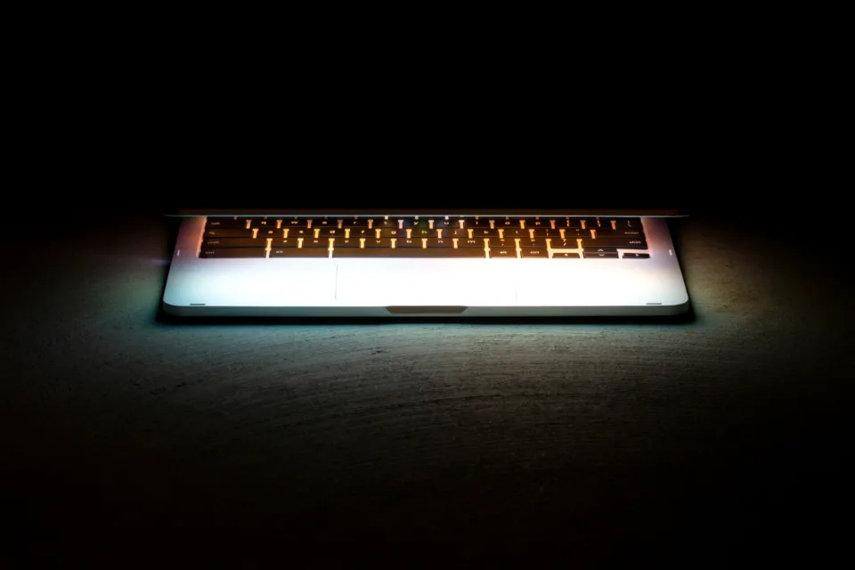 A close-up of a key on a dark surface, standing in for the secrets stored in .env configuration files.